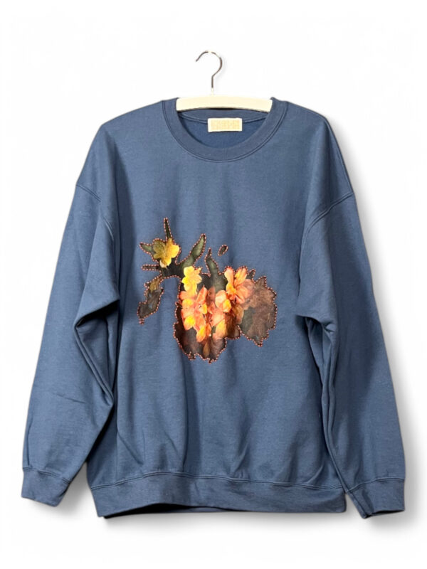Blue Sweatshirt with Orange Floral Patch
